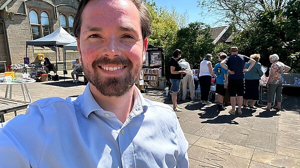 Adam Harley out in Bishopbriggs with people in the background.