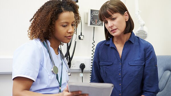 Lung cancer screening Two nurses looking at results.
