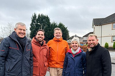 Willie Rennie, Adam Harley, Ben Langmead, Susan Murray and Jamie Greene smiling for a group photo in Bearsden.