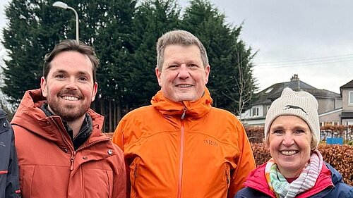 Adam Harley, Ben Langmead and Susan Murray smiling in Bearsden.