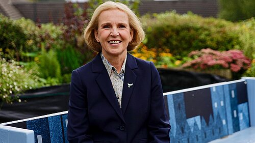 Susan Murray sitting on a bench