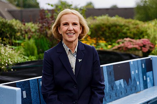 Susan Murray sitting on a bench