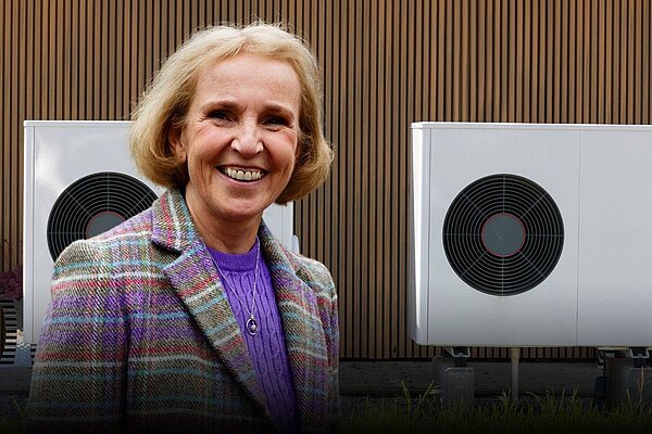 A photo of Susan Murray next to heat pumps with the following text below. Challenging heat pump myths with Susan Murray MP. 5pm 16th Jan. Sign Up.