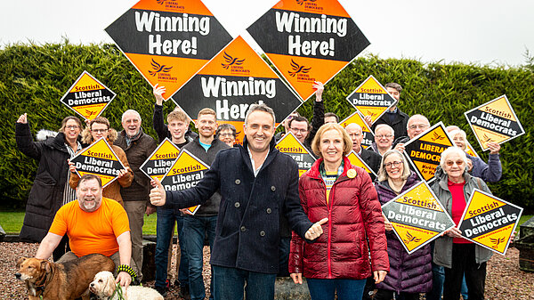 Alex Cole-Hamilton and Susan Murray in front of a group of Scottish Liberal Democrat volunteers