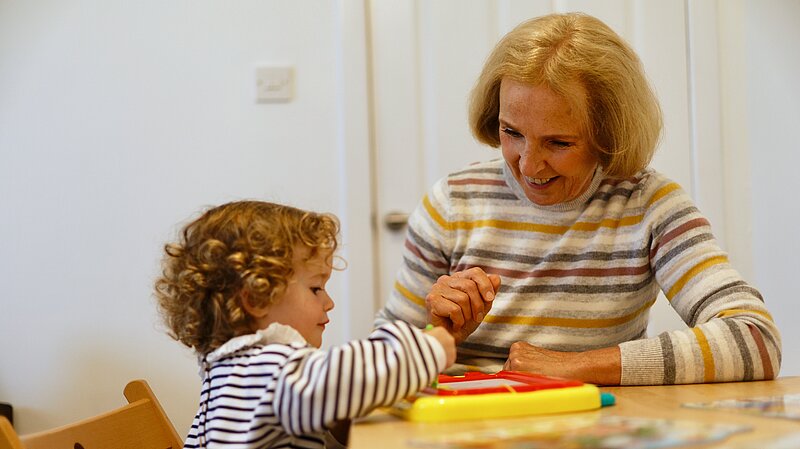 Susan Murray speaking to a child
